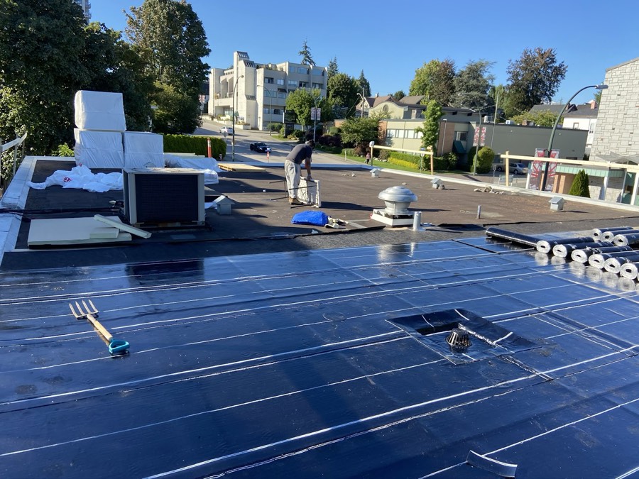 Commercial flat roof with new membrane and rooftop units